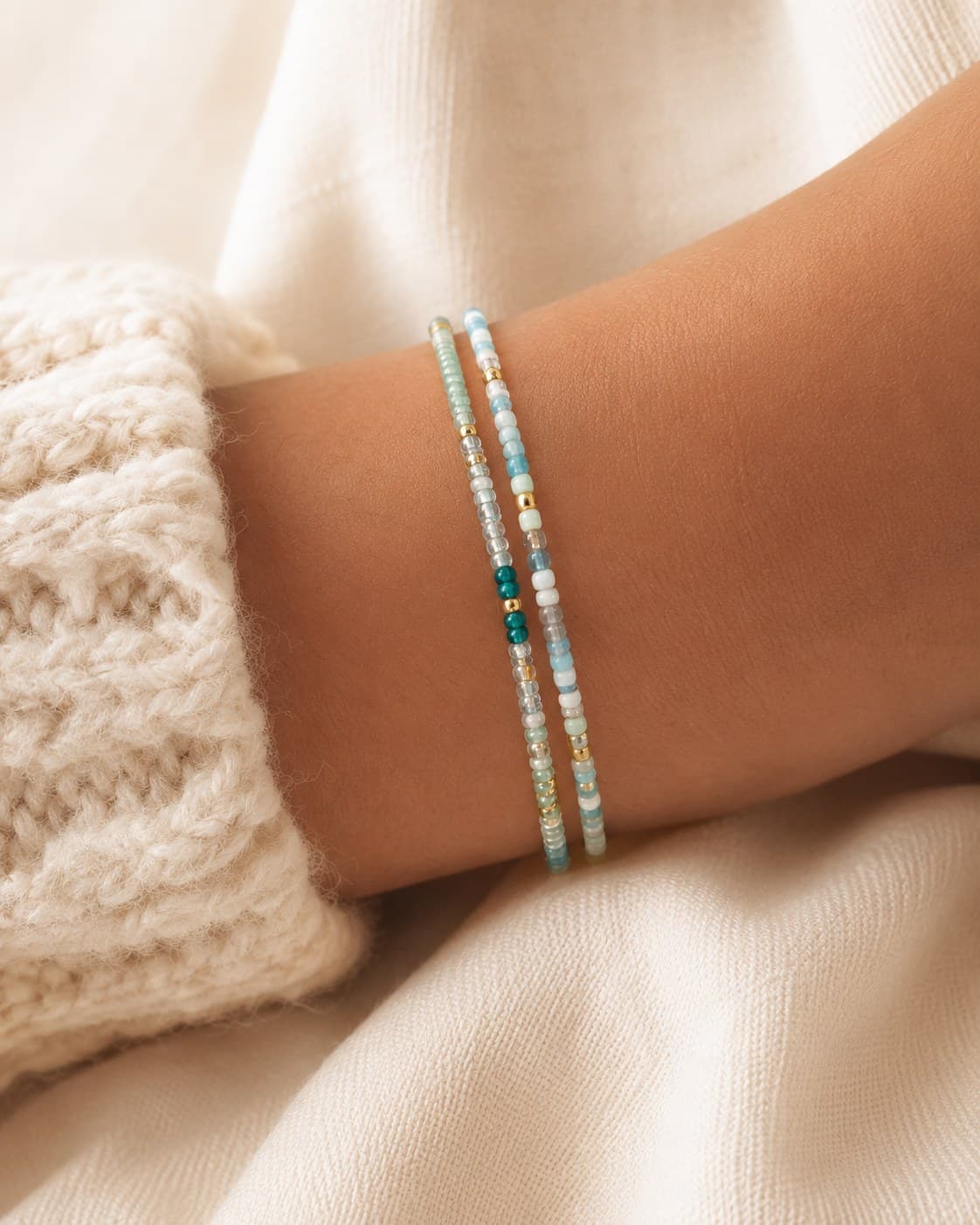 Tiny Turquoise bracelet stack worn on the wrist.